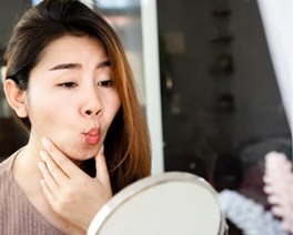 A girl pouting in a mirror