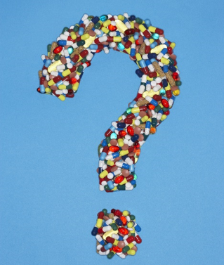 A question mark made of pills